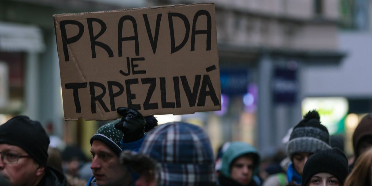 “Truth is patient” (Pravda je trpezlivá) written in Slovak on a banner at last week’s memorial gathering in Brno.